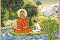 Kailasa Parampara Guru sits in the natural setting of Kauai with a sishya who has come to receive blessings.
